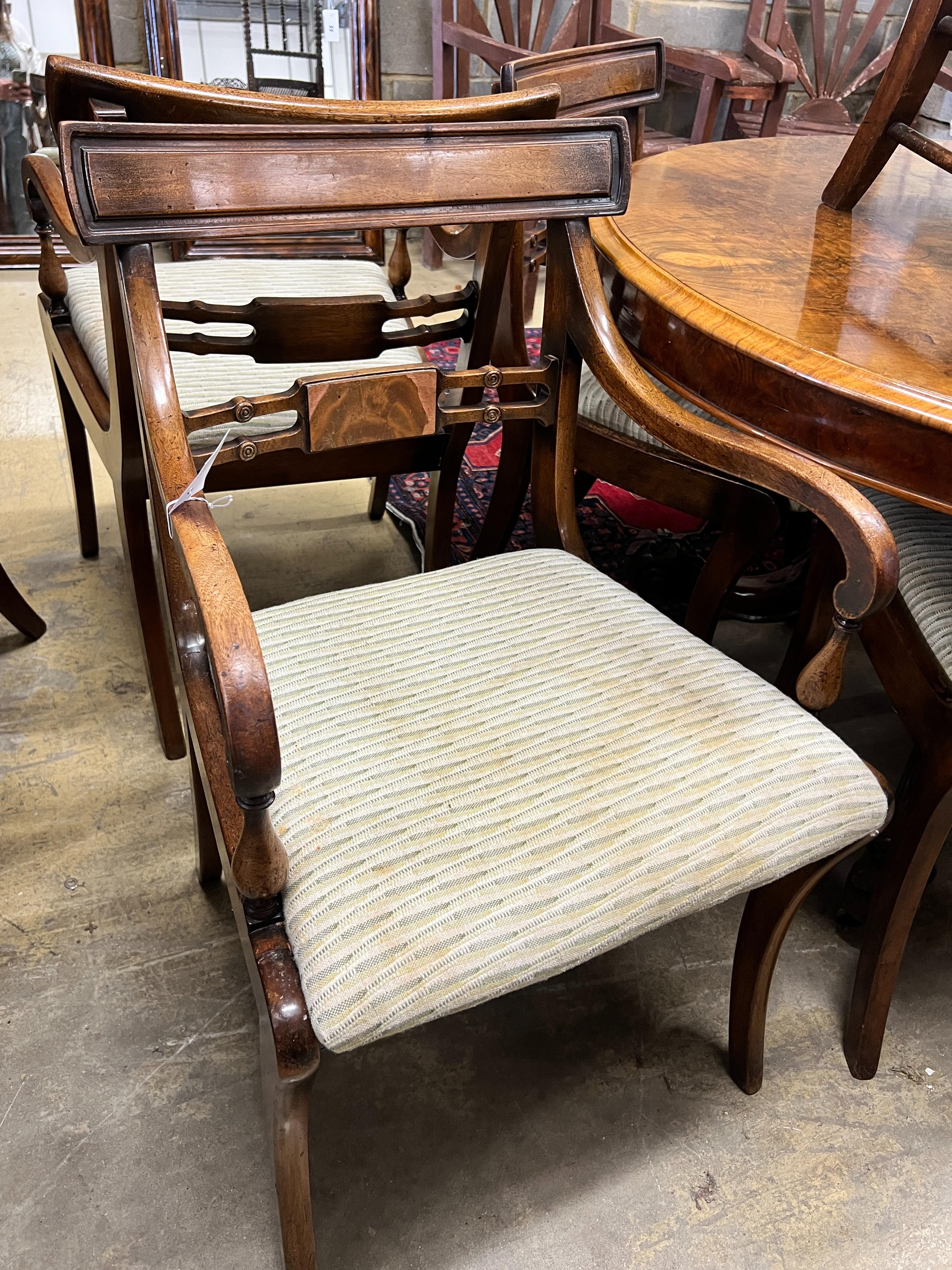 A set of six Regency style mahogany dining chairs, two with arms